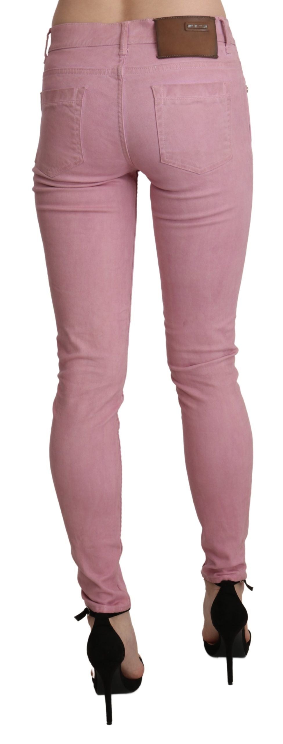 Pantaloni skinny in denim elasticizzato rosa a vita media