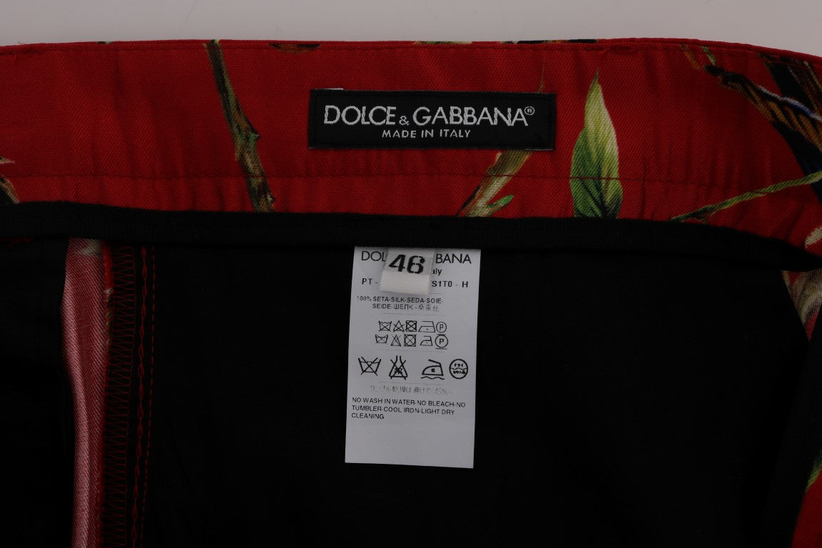 Pantaloni eleganti in seta rossa con stampa di uccelli