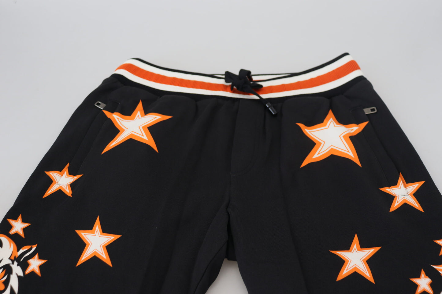 Pantaloni sportivi con stella nera arancione